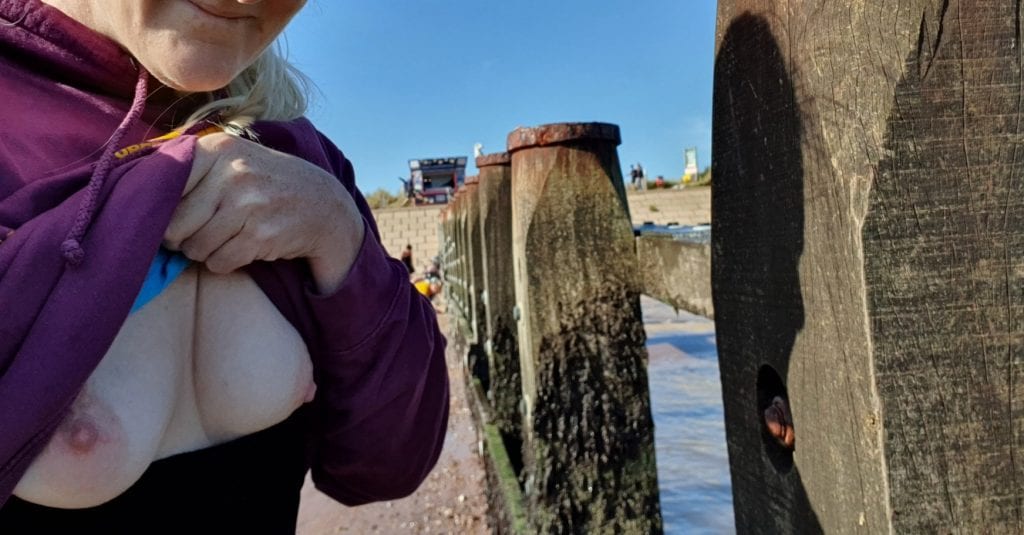 Barefoot sub has her breasts out at the Groyne