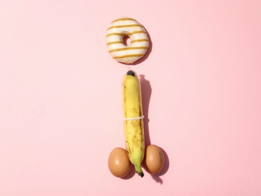 Genitals created with food, banana wearing a condom