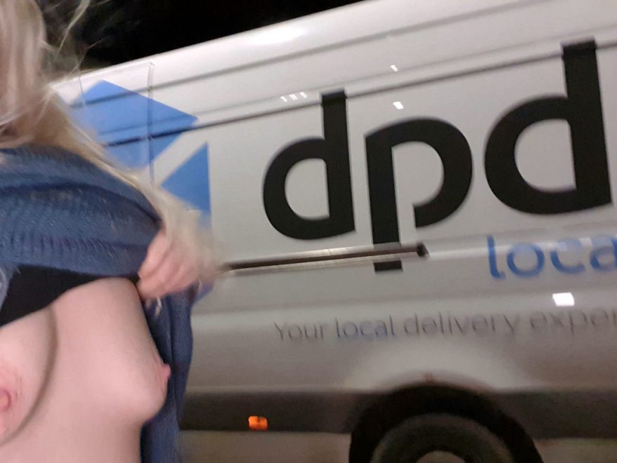 Exposed breasts beside a courier van, for post Special delivery service