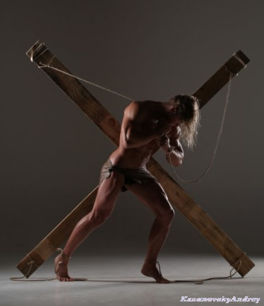 fantasy, needs and a hot octopuss header of man in loin cloth hauling a wooden X over his shoulder