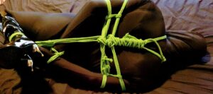 Not taken on my return to the boudoir, this is Alice wearing black spandex body suit, he's tied in a hogtie.