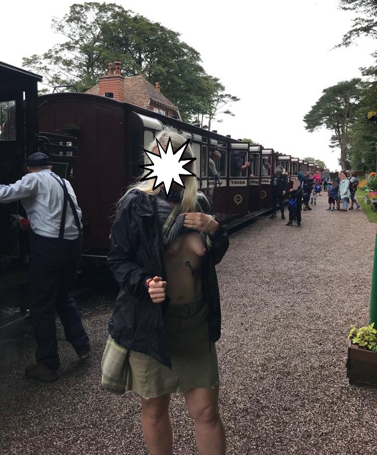 The tourist Attraction all round header image shows me subtly exposing my breasts on a busy train station platform, with the steam train and other passengers in the background.