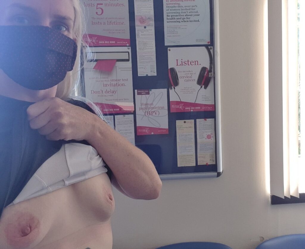 Hospital Scavenging header shows lady in a face mask exposing her breasts in front of a notice board filled with Jo's Trust information poster. (link at bottom of the post)
