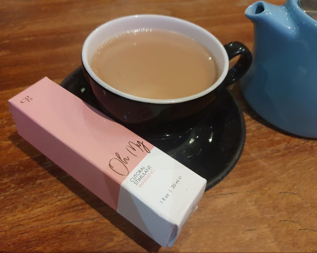Rookie Mistake? Oh My! header image shows box of Oh My warming clitoral stimulant balanced on the saucer of a cup of tea