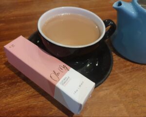 Rookie Mistake? Oh My! header image shows box of Oh My warming clitoral stimulant balanced on the saucer of a cup of tea