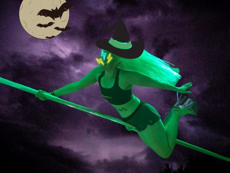 Witching hour header image shows me posing on a pole in killer heels, short-shorts and sports bra. Edited to look like I'm flying on a broom.