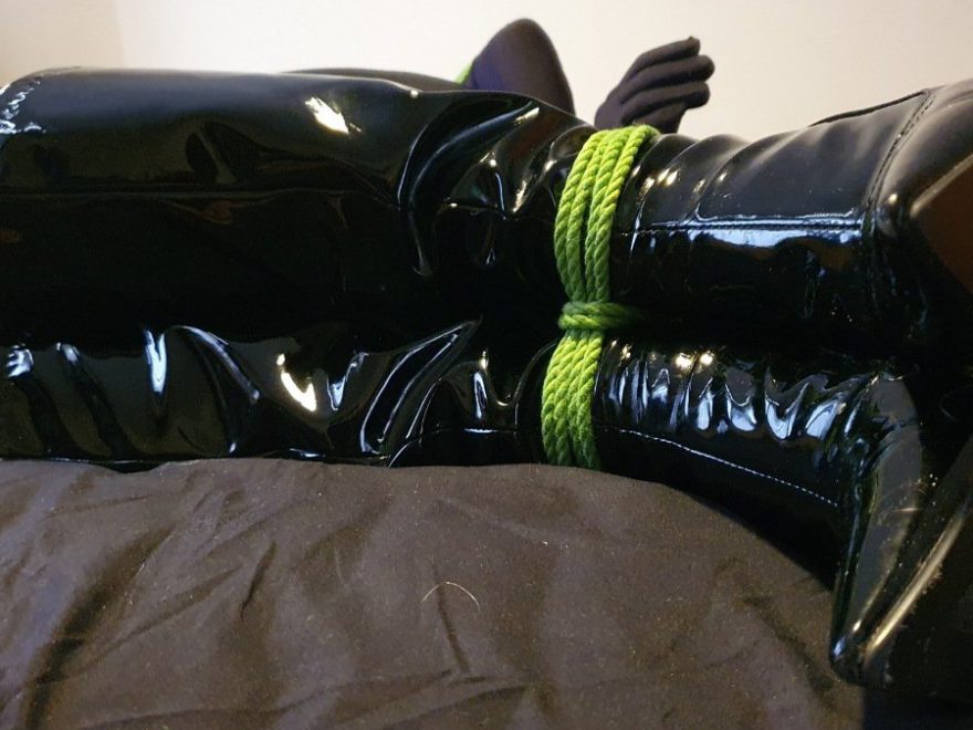 Self censoring header shows A picture of Alice's shiny heels, bound at the ankles with green rope.