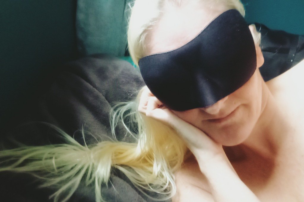 Blonde woman laying Naked and blindfolded for anonymous fuck and go.