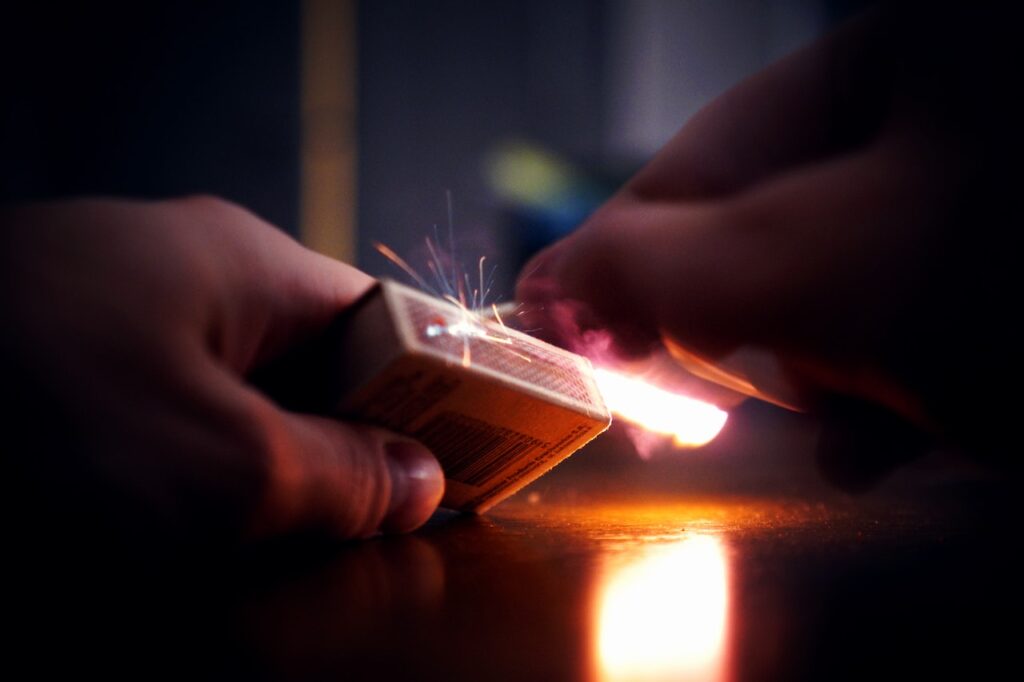 light a match to start a fire