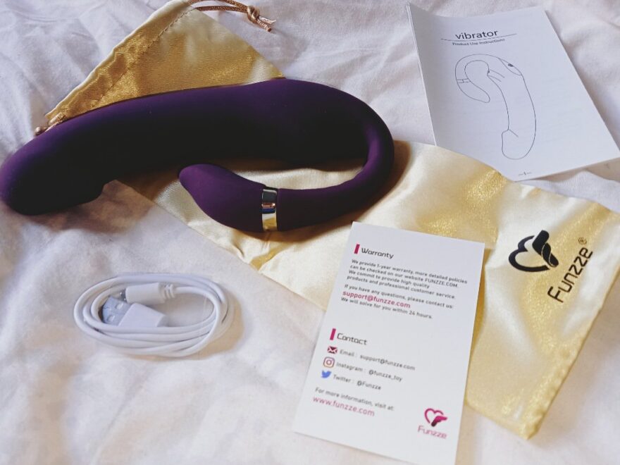 Out of the box the eggplant vibrator with the toy bag, instructions and charging cable.