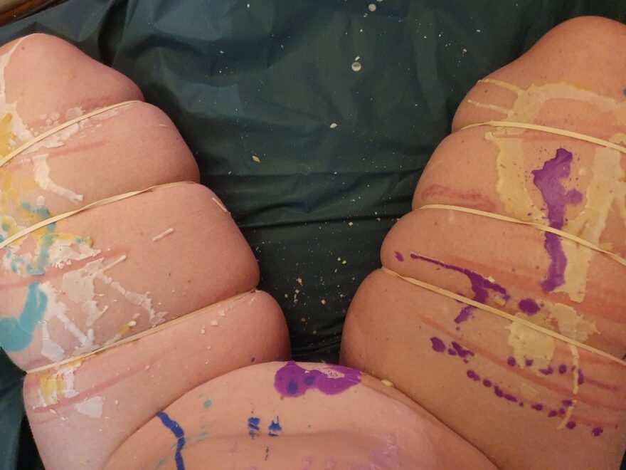 wax on wax off header image shows my thighs splattered with wax, and trussed up by rubber bands.