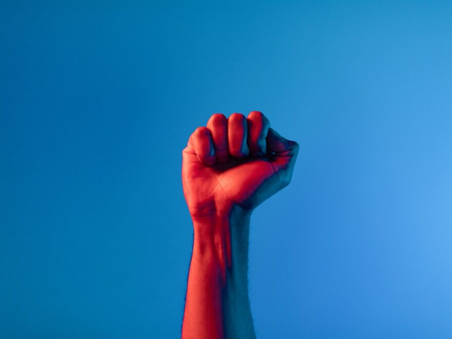 Does self fisting scare you? Header shows a fist illuminated in red on a blue background.