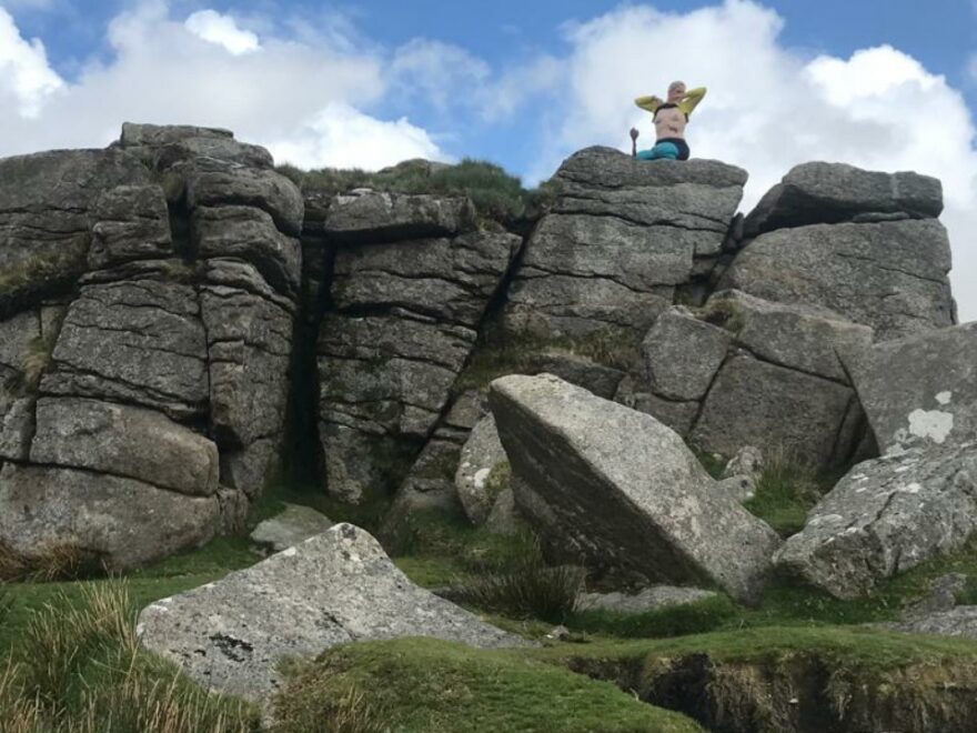 Exposing my breasts atop South Hessary Tor beside the sword in the stone.