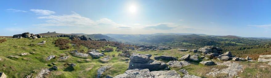 Hide and Seek header image shows a panoramic shot of Dartmoor with blue skies and sunshine