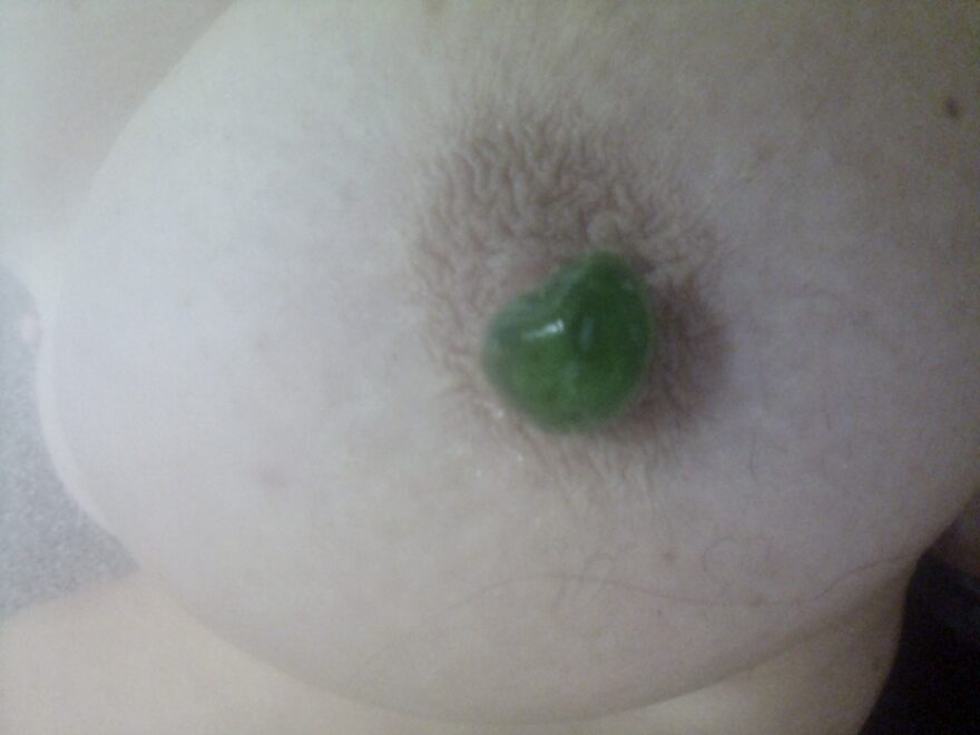 Cherry pop: Guest breast with green sweetie covering nipple