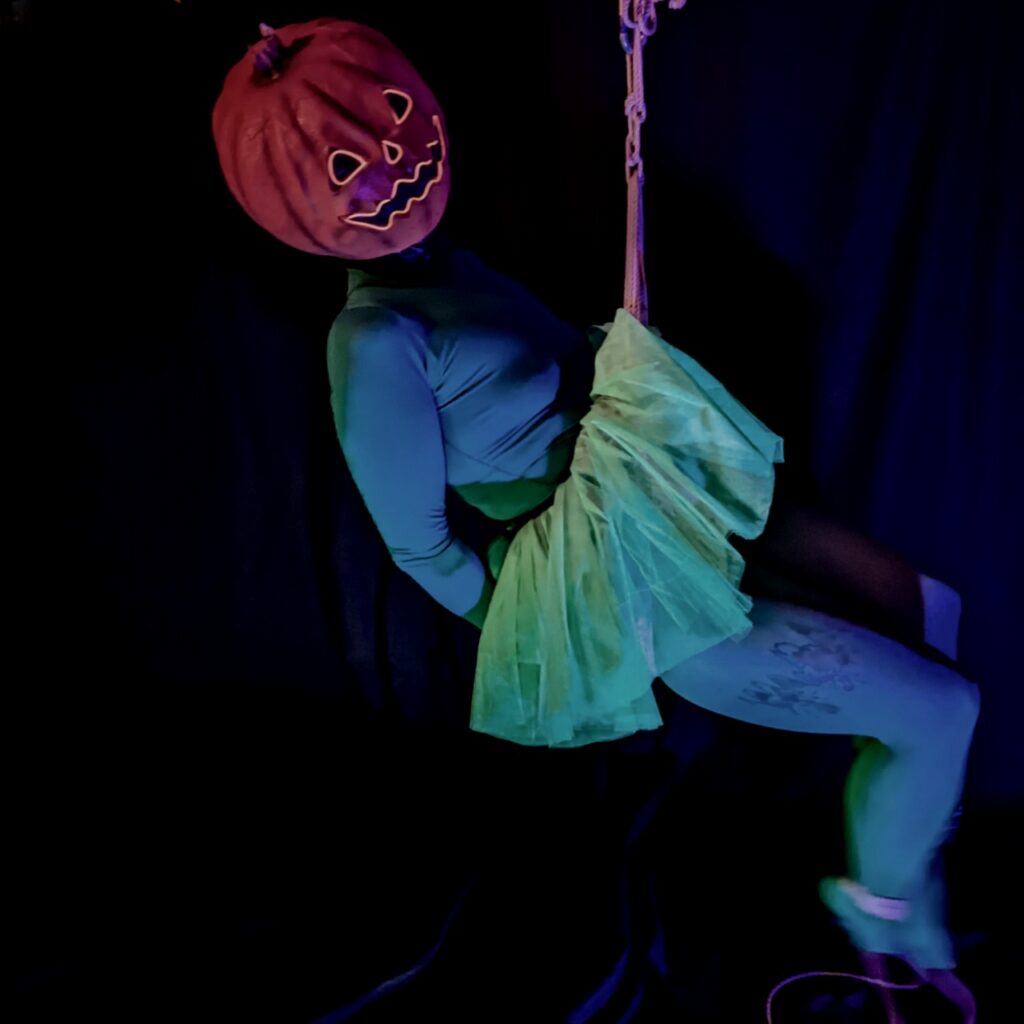 Photo, inspired by halloween, of me having fun swinging around in rope, dressed up as a Pumpkin