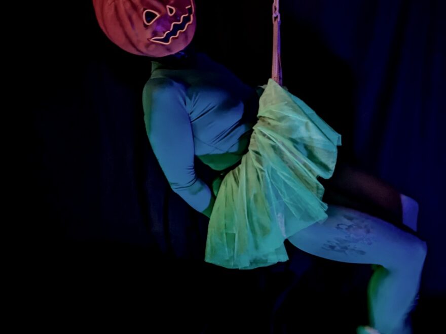 Photo, inspired by halloween, of me having fun swinging around in rope, dressed up as a Pumpkin