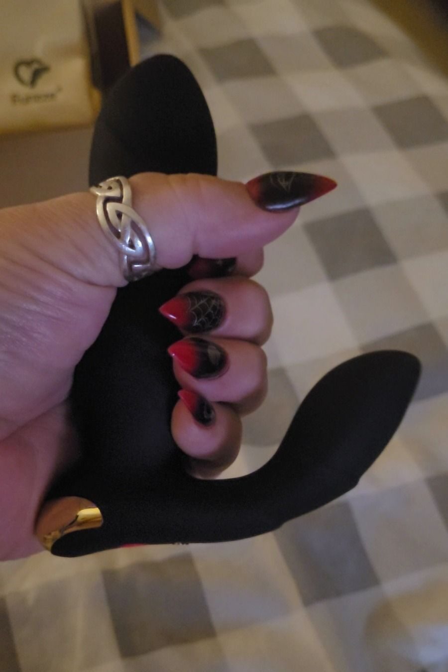 the thrusting prostate massager from Funzze in CC's hand